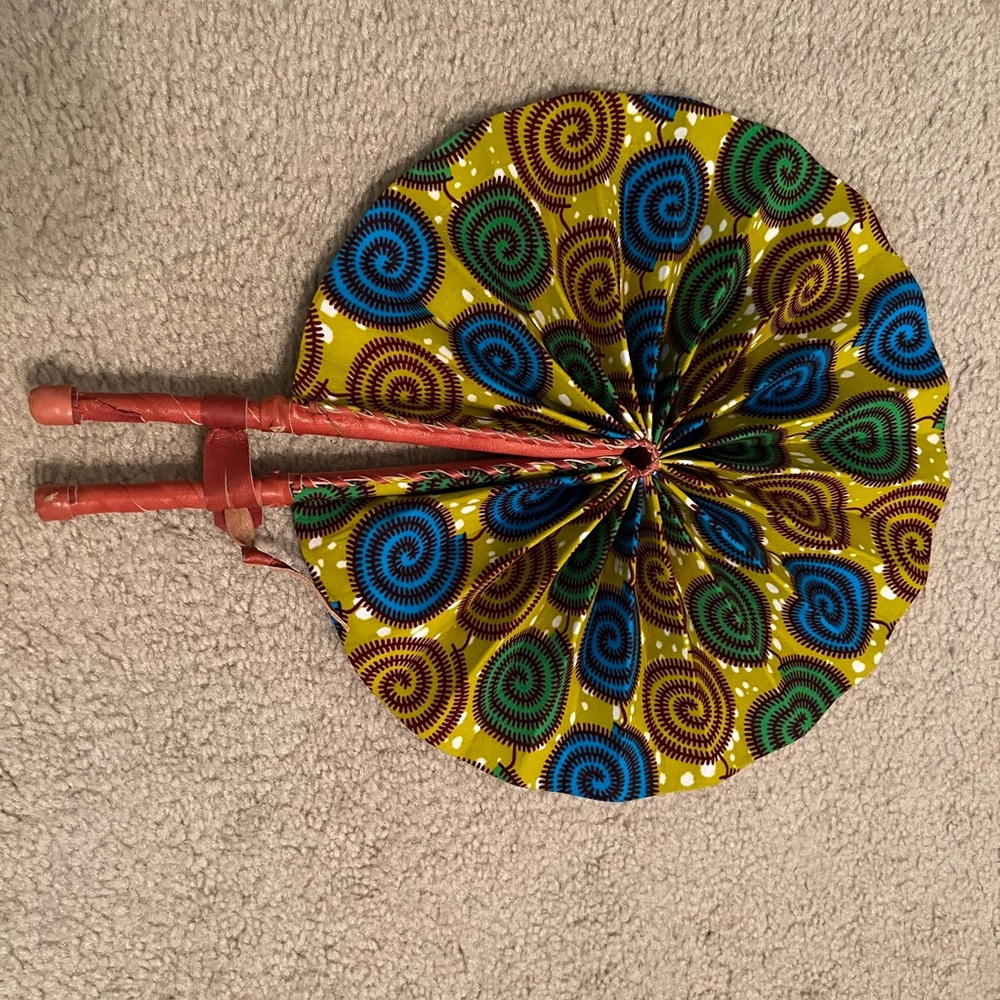 Leather and cloth fan from Ghana. Folds for easy fit in you purse or pack.